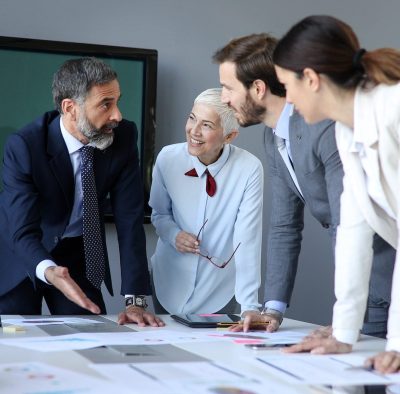 Creative business people working on business project in office